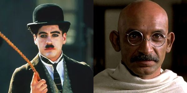 Movie still of Robert Downey Jr. as Charlie Chaplin in Chaplin (1992) and Ben Kingsley as Ghandi in Ghandi (1992)