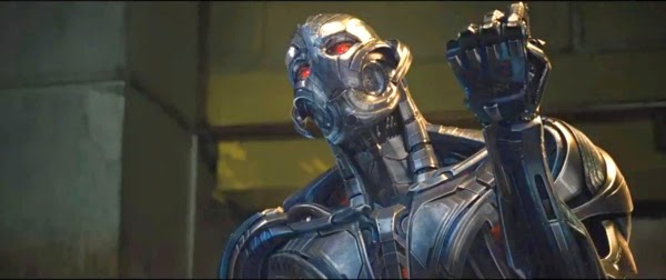 Ultron, played by James Spader, in his robot body raiging his fist in a scene from Avengers: Age of Ultron 