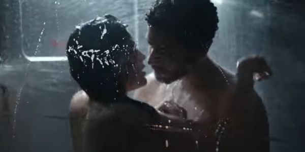 Movie still of Callie Hernandez as Upworth and Jussie Smollett as Ricks shower in Alien: Covenant (2017)