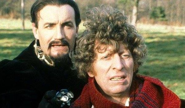 Television still of John Fraser as The Monitor and Tom Baker as Doctor Who in Doctor Who