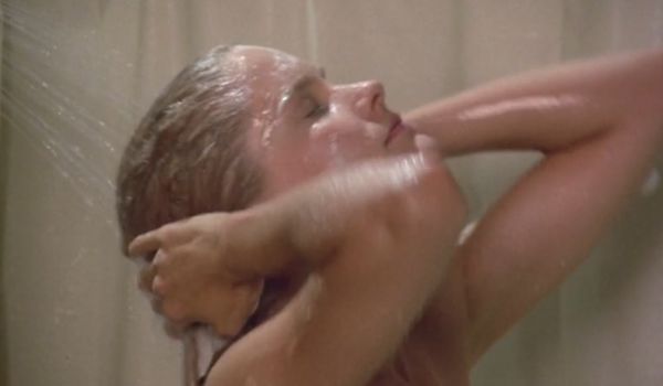 Movie still of Suzanne Snyder as Debbie Stone shower in Killer Klowns from Outer Space (1988)
