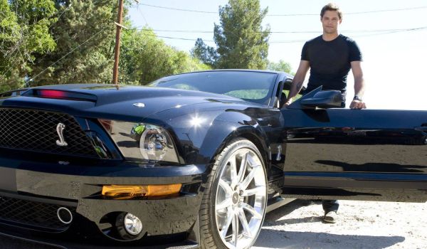 Television still of Justin Bruening as Mike Traceur and Val Kilmer as K.I.T.T. in the show Knight Rider 2008