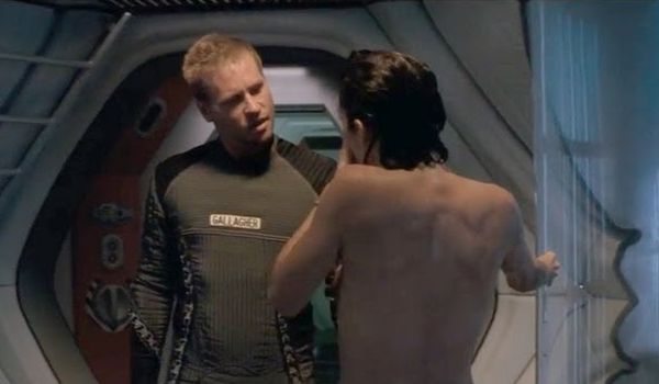Movie still of Val Kilmer as Gallagher and Carrie-Anne Moss as Bowman shower in Red Planet (2000)