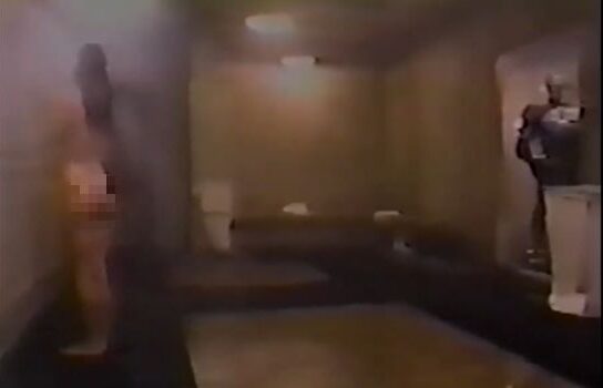 Movie still of Peter Weller as Robocop shower in RoboCop 2 (1990)