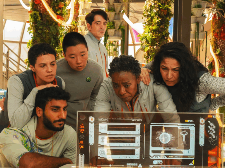 Television still of Akshay Khanna as Ratthi, Tattiawna Jones as Arada, Sabrina Wu as Pin-Lee, David Dastmalchian as Gurathin, Noma Dumezweni as Mensah, Tamara Podemski as Bharadwaj in the Murderbot episode "Eye Contact"