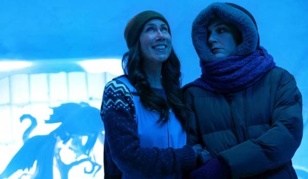 Television still of Miriam Shor as Helen and Rhea Seehorn as Carol Sturka in the sci-fi show Pluribus episode "Grenade"