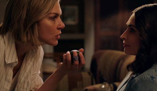 Television still of Rhea Seehorn as Carol Sturka and Karolina Wydra as Zosia in the sci-fi show Pluribus episode "Grenade"