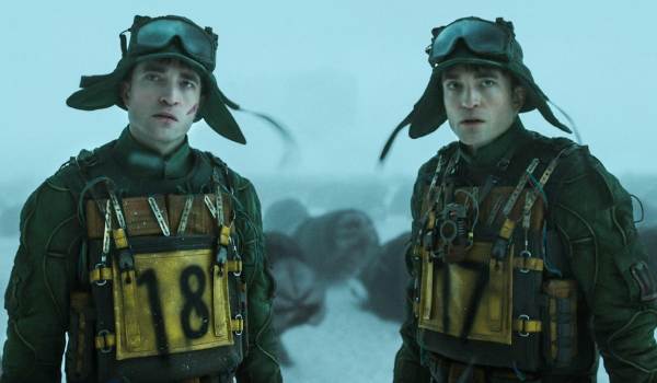 Movie still of Robert Pattinson as Mickey Barnes 18, and Robert Pattinson as Mickey Barnes 17 in the sci-fi movie Mickey 17 (2025)