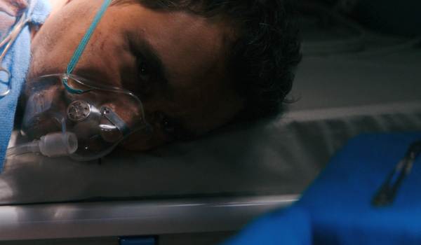 Television still of Carlos-Manuel Vesga as Manousos Olivedo in the sci-fi show Pluribus episode "Charm Offensive"