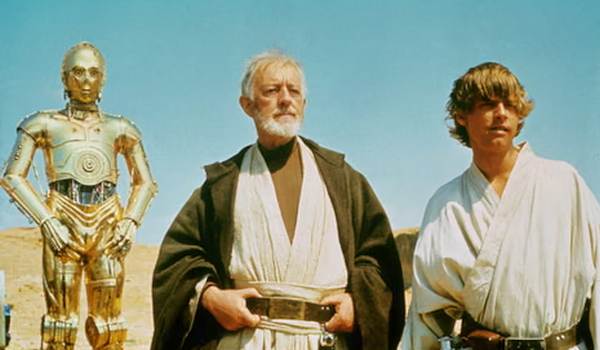 Movie still of Anthony Daniels as C-3PO, Alec Guinness as Ben Obi-Wan Kenobi, and Mark Hamill as Luke Skywalker  in the sci-fi movie Star Wars: Episode IV - A New Hope (1977)