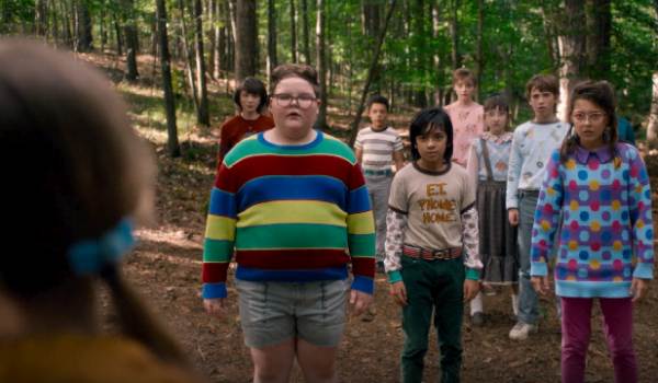 Television still of Nell Fisher as Holly Wheeler, Jake Connelly as Derek Turnbow in the sci-fi show Stranger Things episode "Chapter Eight: The Rightside Up"