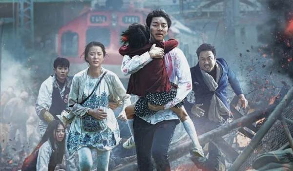 Movie still of Gong Yoo as Seok-woo, and Jung Yu-mi as Seong-kyeong in the sci-fi movie Train to Busan (2016)