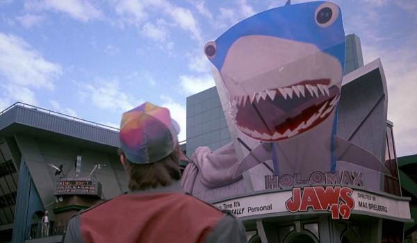 Movie still of Michael J. Fox as Marty McFly looking at a holographic shark in the sci-fi movie Back to the Future Part II (1989)