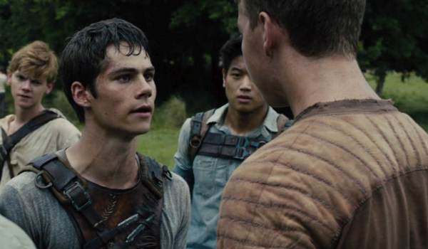 Standoff scene from The Maze Runner with Thomas (Dylan O'Brien) facing Gally (Will Poulter) in the Glade, flanked by Newt and Minho.