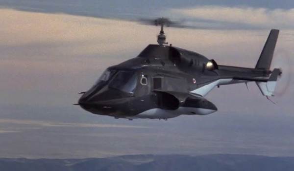 Jan-Michael Vincent as Stringfellow Hawke piloting the Airwolf supersonic helicopter through the sky in a scene from the television series Airwolf.