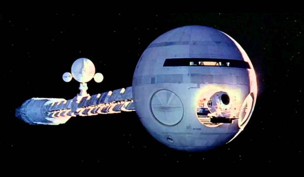 The 2001: A Space Odyssey starship Discovery One traveling through deep space