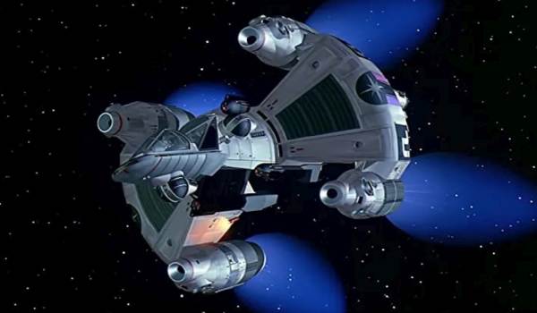 The Last Starfighter starship Gunstar maneuvering through a star-filled void.