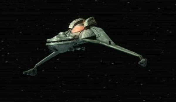 The Star Trek starship Klingon Bird-of-Prey cruising through deep space.