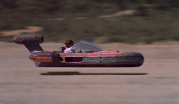 Luke Landspeeder flying over the sands of Tatooine in Star Wars