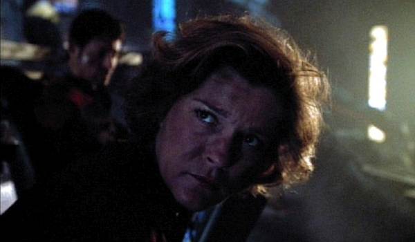 Kate Mulgrew as Captain Kathryn Janeway in a dark, dramatic scene from the Star Trek: Voyager episode "Year of Hell."