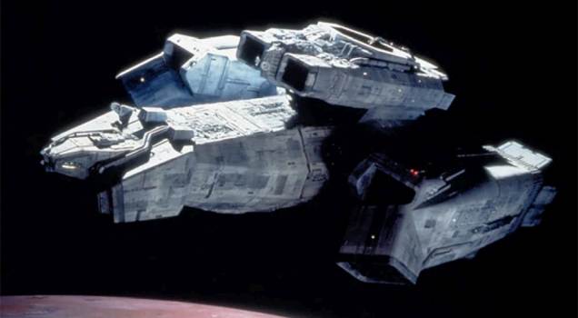 The Alien starship USCSS Nostromo in orbit above a desolate planet.