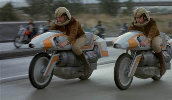 Barry Van Dyke as Dillon and Kent McCord as Troy riding flying Turbine Motorcycles in a scene from the television series Galactica 1980.