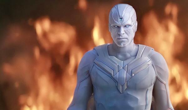 Television still of Paul Bettany as White Vision against a firery backgronnd in the sci-fi show WandaVision