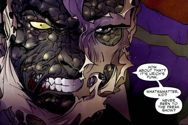 A close-up comic book panel from Spider-Man Noir showing a villain with a severely scarred, bumpy, reptilian face snarling as a mask rips away.
