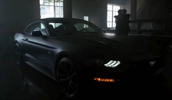 The Bat Mobile batmobile 2018 Ford Mustang GT Premium Fastback from the Fox show Gotham in a dark warehouse