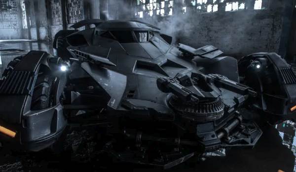 The Batfleckmobile batmobile from Batman v Superman: Dawn of Justice in a dark warehouse