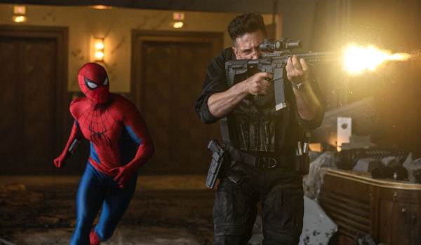 Spider-Man (Tom Holland) running forward alongside The Punisher (Jon Bernthal), who is firing a scoped rifle with a muzzle flash in a scene from Spider-Man: Brand New Day.