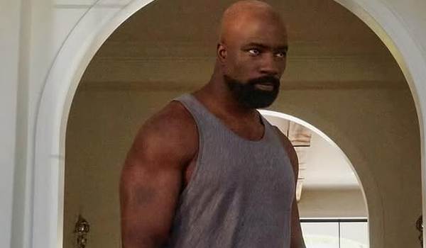 Mike Colter as John in a scene from the television series Accused. A tattoo is visible on his right arm