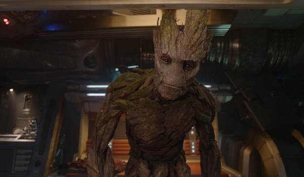 Groot looking forward with a gentle expression inside the Guardians of the Galaxy spacecraft.