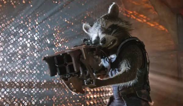 Rocket Raccoon aiming a large, futuristic blaster in a scene from the Marvel movie Guardians of the Galaxy.