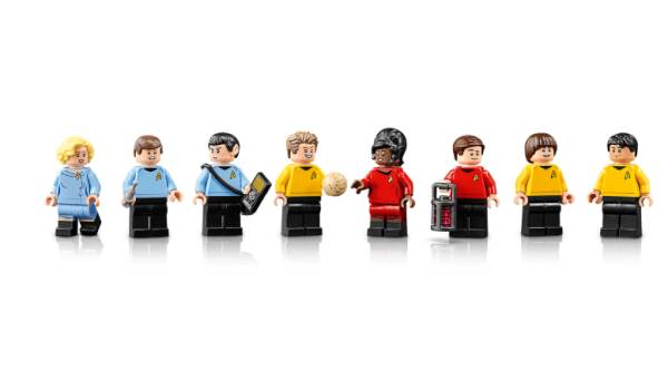 Eight Star Trek: The Original Series LEGO minifigures including Captain Kirk, Mr. Spock, Uhura, and Dr. McCoy in classic uniforms