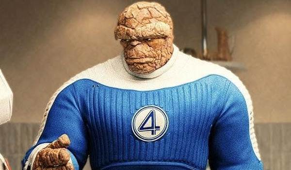 Ebon Moss-Bachrach as Ben Grimm, The Thing, wearing his blue and white Fantastic Four team uniform in the 2025 movie The Fantastic Four: First Steps.