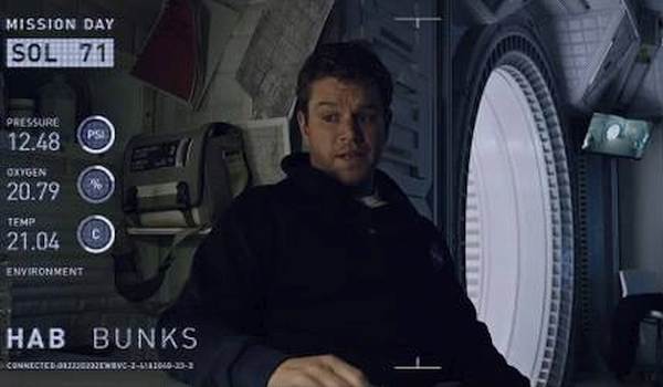 Matt Damon as Mark Watney recording a video log in the hab bunk in the 2015 film The Martian.