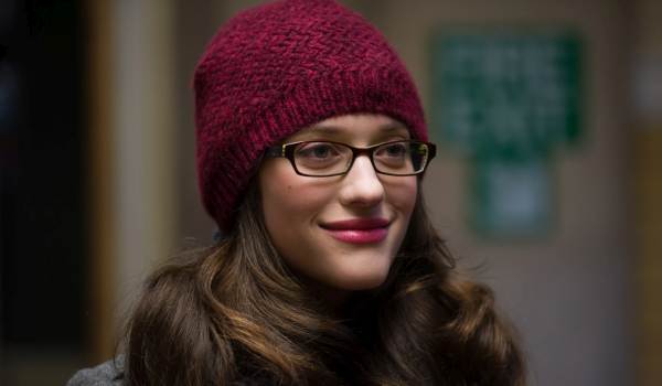Kat Dennings as Darcy Lewis wearing a maroon beanie and glasses in the movie Thor.