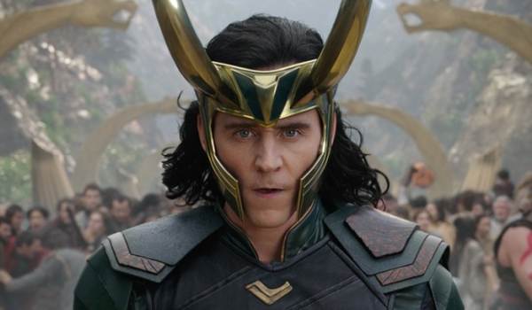 Tom Hiddleston as Loki wearing his signature horned helmet and armor in the Marvel movie Thor: Ragnarok.
