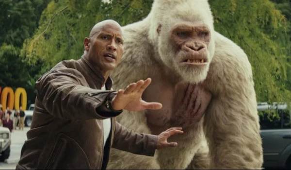 Davis Okoye gesturing protectively in front of the giant albino gorilla George, Rampage