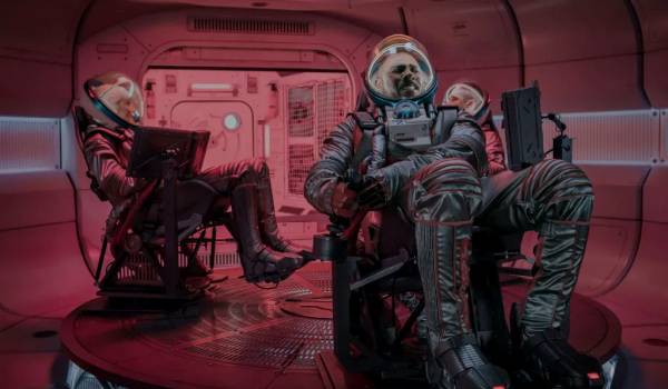 Idris Elba as Jackson, Hero Fiennes Tiffin as Rhodes, and Caitlin FitzGerald as Brookes in the sci-fi movie Above the Below (2026)