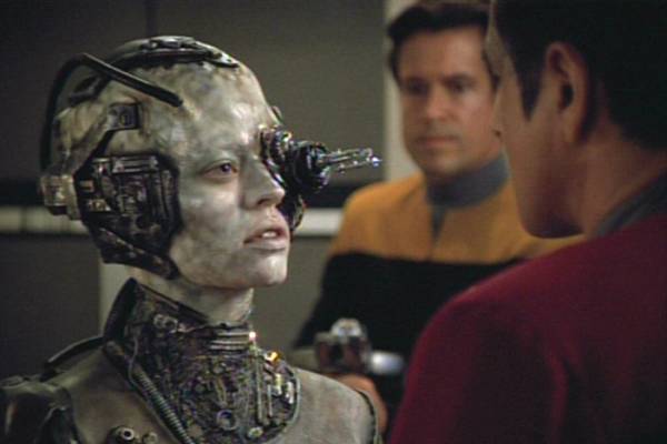 Television still of Jeri Ryan as Seven of Nine, Robert Beltran as Cmdr. Chakotay in the sci-fi show Star Trek: Voyager